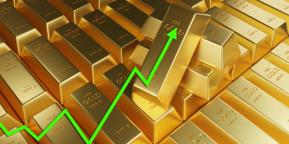 An upward arrow on gold bars showing an increase in the current gold prices
